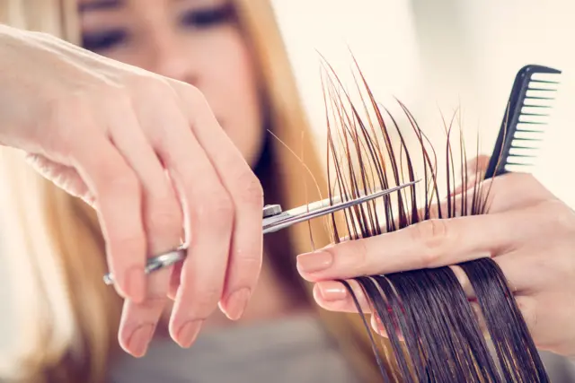 woman cutting hair