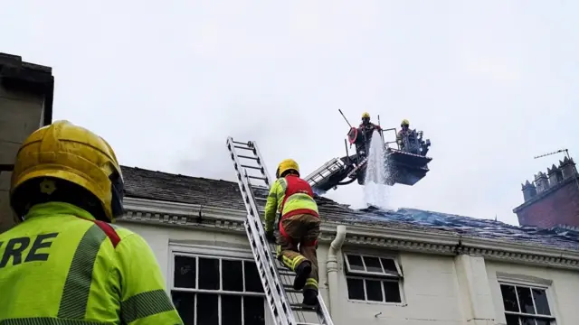 Firefighters on roof