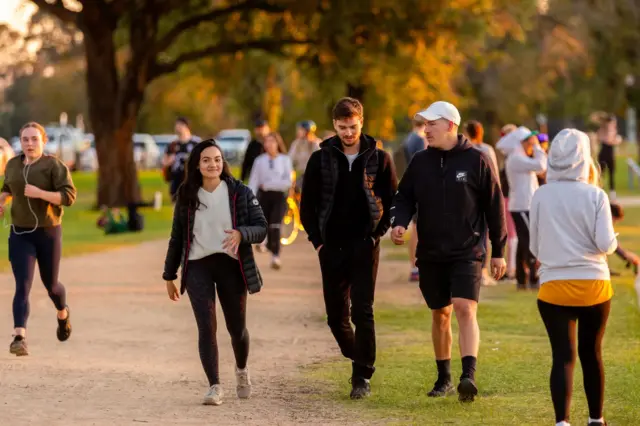 People exercise at Albert Park, Melbourne