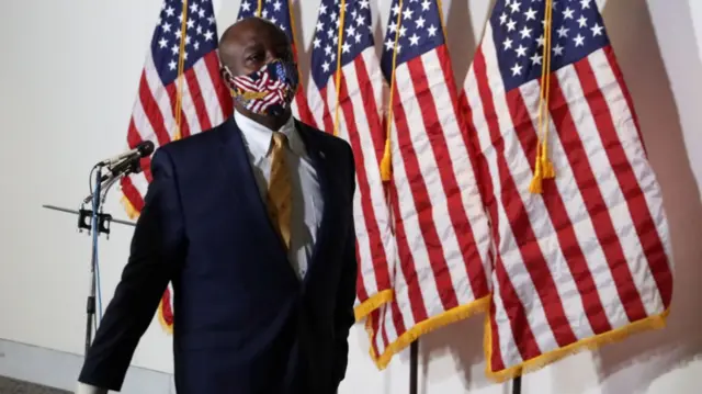 Man in face mask with US flag on it