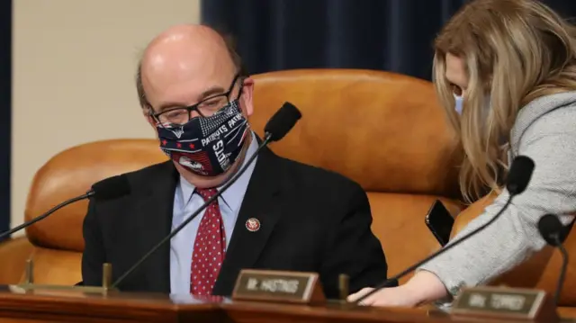 Man in New England Patriots face mask