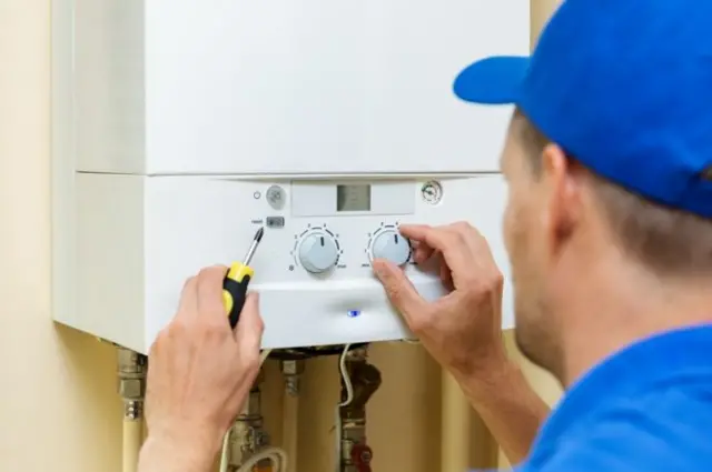 Man working on boiler