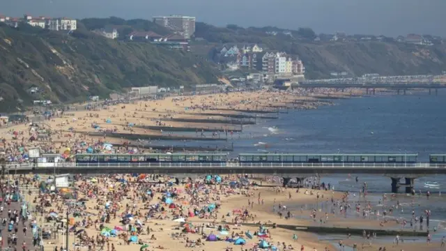 Many people were pictured basking in the hot weather at Bournemouth beach in Dorset on Wednesday