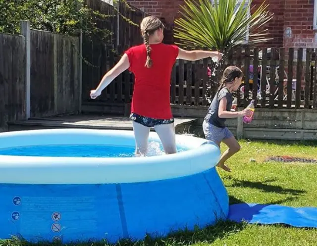 Children in paddling pool