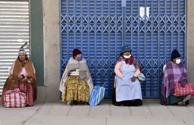 Women outside a bank in El Alto, Bolivia, on May 18, 2020