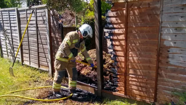 Fence panel burned by bonfire