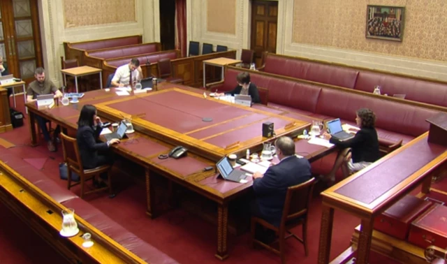 Wide shot of committee