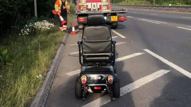 The scooter on the carriageway