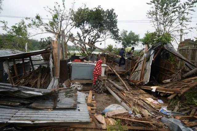 Villagers repair their house damaged by cyclone Amphan in Satkhira on May 21, 2020.