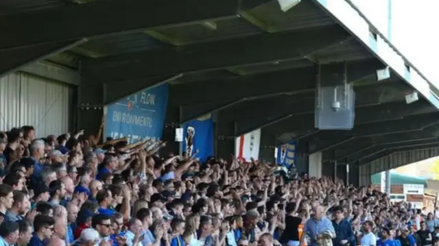 AFC Wimbledon fans in the stands at Kingsmeadow