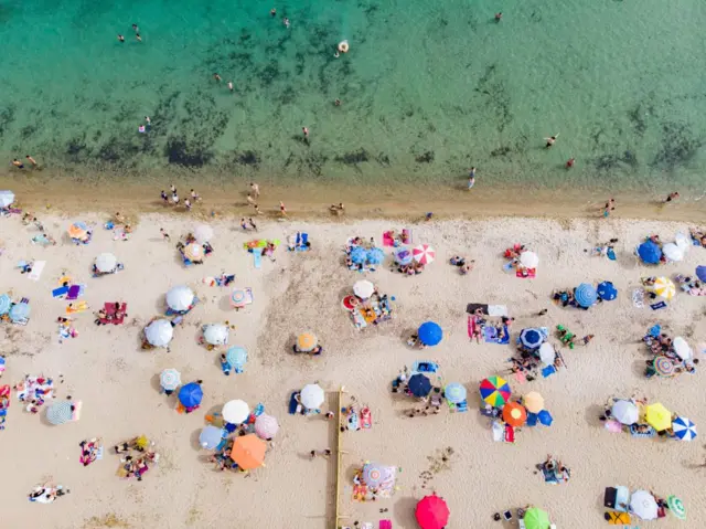 Drone View Of Crowded Beach During Covid-19 Easing Measures Era In Greece