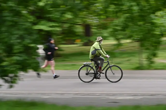 Cyclist passing jogger