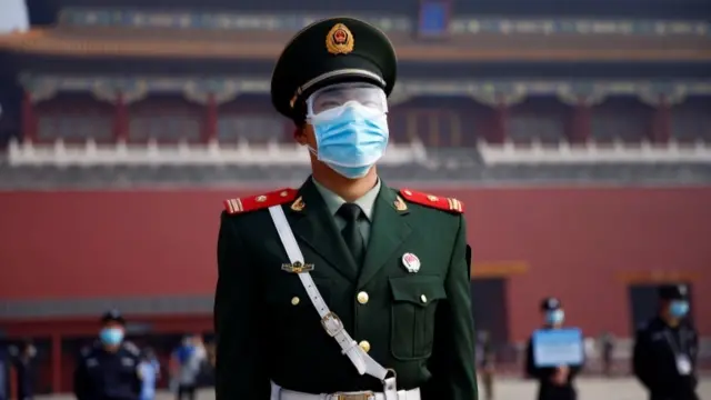 Chinese policeman wearing a face mask