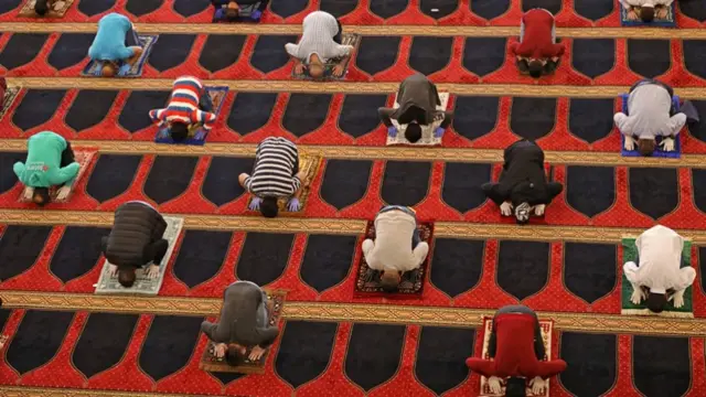 People praying in a mosque