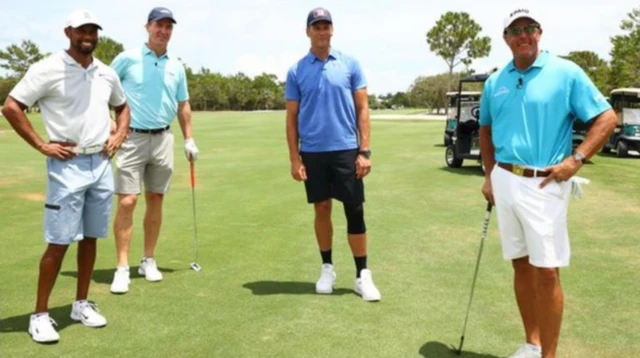 Tiger Woods and Peyton Manning with Phil Mickelson and Tom Brady at their charity golf match