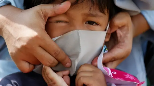 Child with face mask