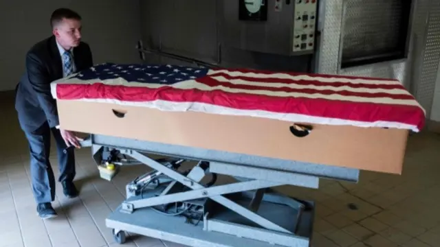 Coffin draped in US flag