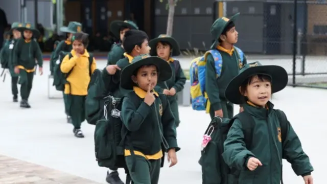 Children walk into the school yard in Hurstville in Sydney's south