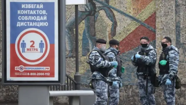 Russian policemen stand guard during the coronavirus pandemic