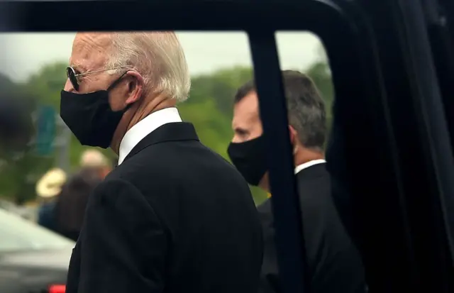 Former US Vice President Joe Biden (L) departs the Delaware Memorial Bridge Veteran's Memorial Park after paying respects to fallen service members in New Castle, Delaware, May 25, 2020