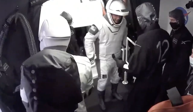 astronauts exit craft