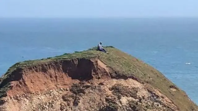 A man on the stop of the stack