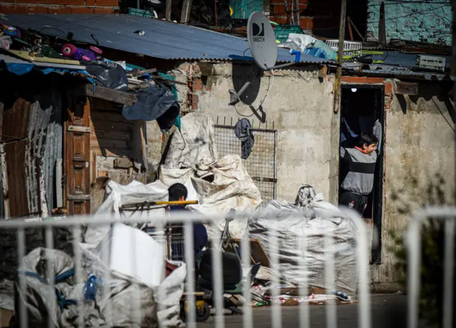 Fences in front of shanty houses