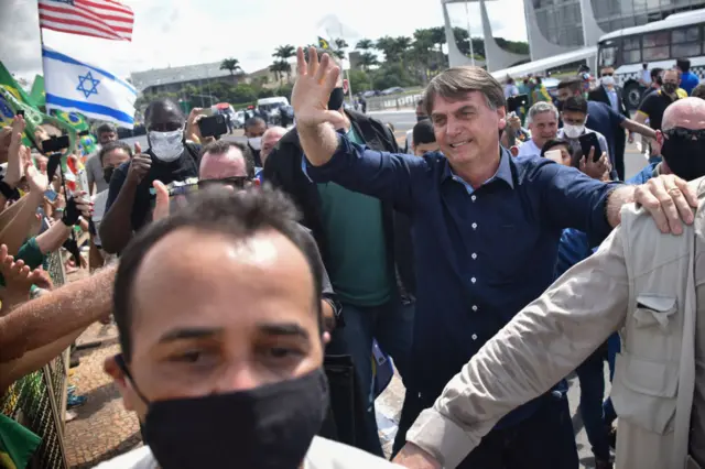 Brazil's President Jair Bolsonaro greets his supporters - 24 May