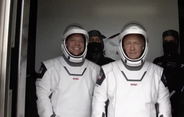 astronauts in elevator