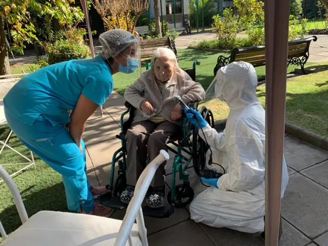 Juana Zúñiga being interviewed at her care home