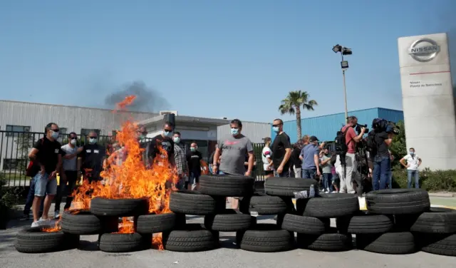 Tyres burnt outside Nissan's factory in Barcelona