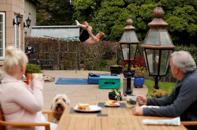 British diver James Heatly trains as his parents look on at his home in Balerno, Scotland