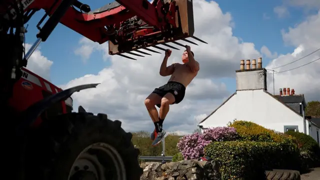 Rugby player Alex Craig works out at his parents' farm