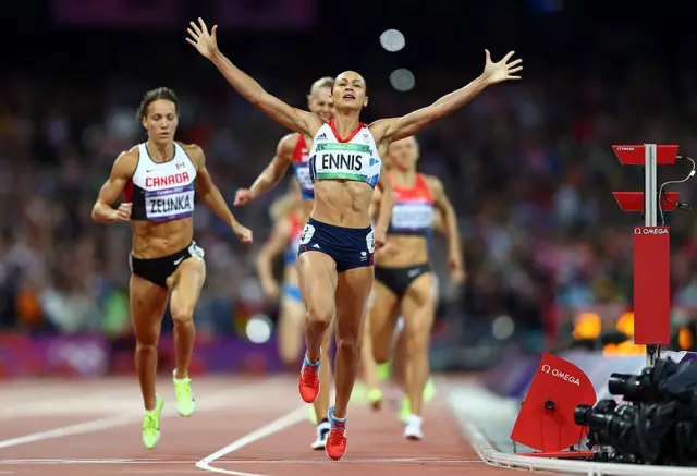 Jess Ennis celebrates as she crosses the line