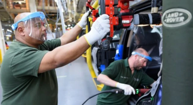 Two workers building a vehicle at Jaguar Land Rover