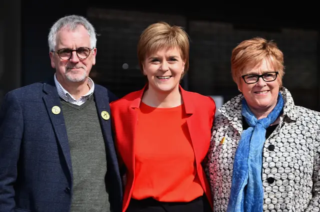 First Minister Nicola Sturgeon stands with her mother Joan and father Robin