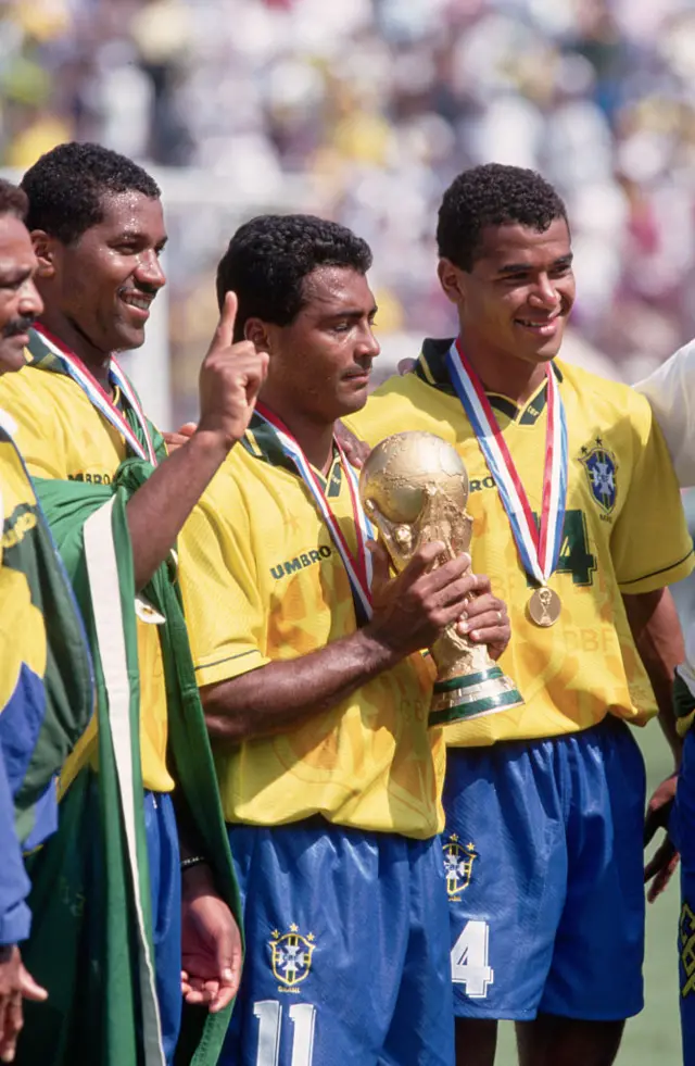 Cafu (right) celebrates Brazil's 1994 World Cup win with Romario (holding the trophy)