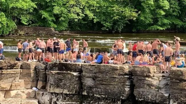 Crowds at Richmond Falls in Yorkshire on Monday