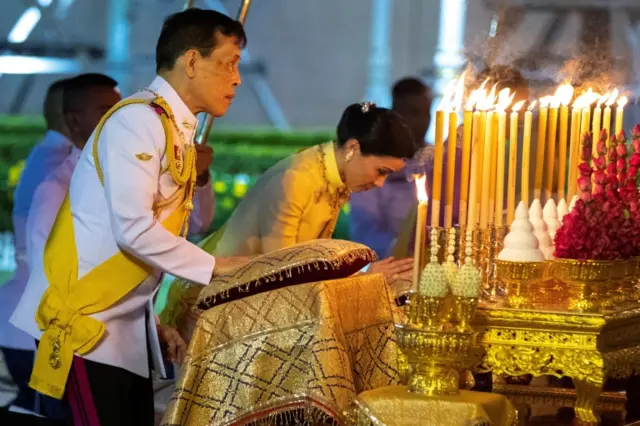 Thailand's King Maha Vajiralongkorn and Queen Suthida pay their respects to the King Rama I monument