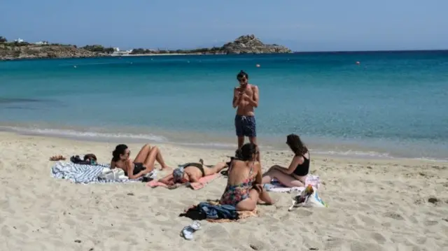 Platis Gialos Beach remains nearly empty at the beginning of the delayed tourist season in Mykonos, Greece on Sunday, May 25, 2020