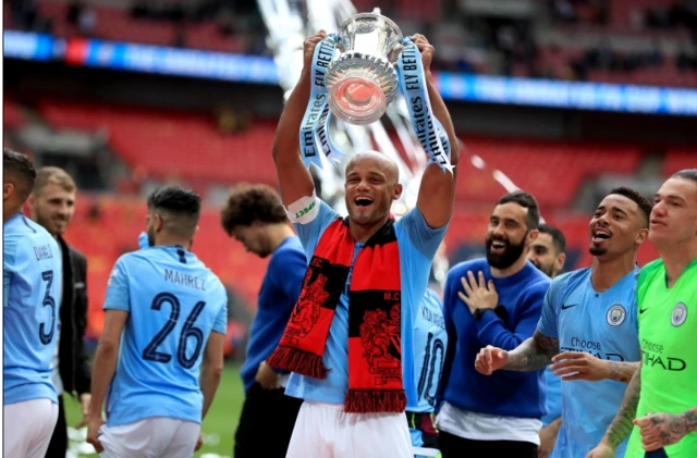 Manchester City captain Vincent Kompany with the FA Cup after his side's 6-0 win over Watford in the final