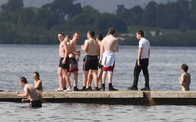 Youths enjoy bathing at Loch Lomond