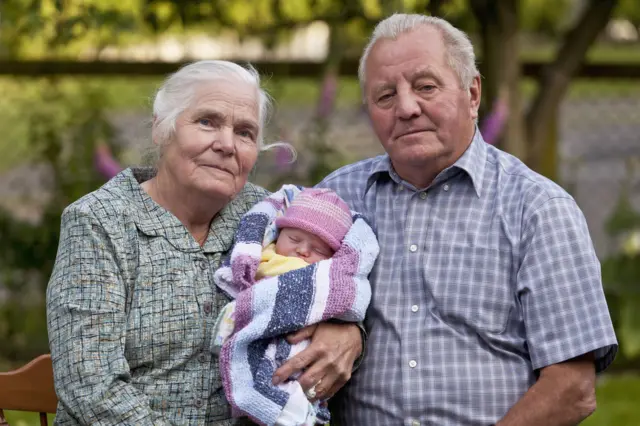 Grandparents with grandchild