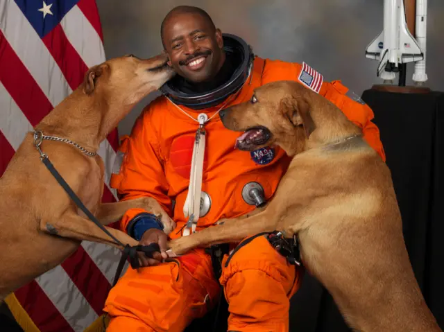 Leland Melvin and dogs