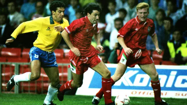 Dean Saunders on the attack for Wales against Brazil