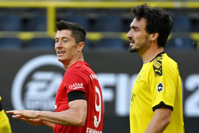 Borussia Dortmund's Mats Hummels with Bayern Munich's Robert Lewandowski