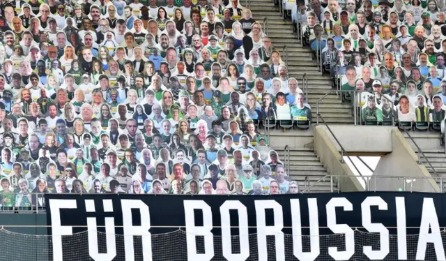 Cardboard cutouts of Borussia fans