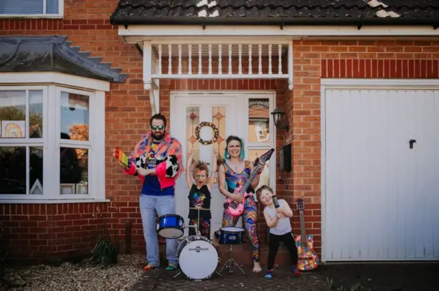 Anna and Chris Hughes dressed up for their portrait with Jasper, 6, and Rafferty, 3