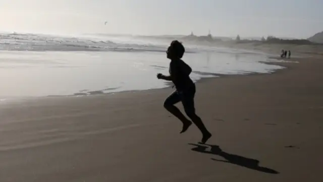 Child running on the beach