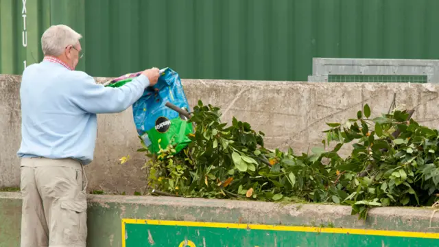 A man using a recycling centre